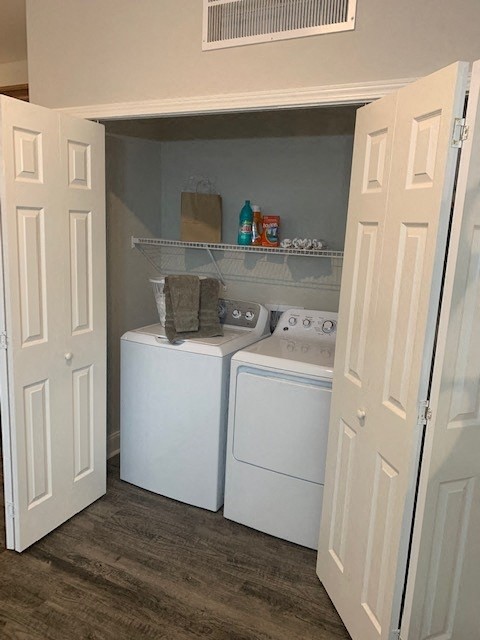 a small laundry room with two washing machines