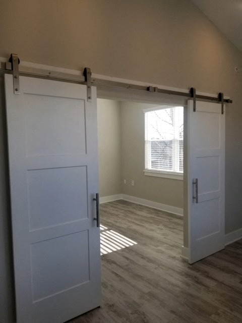 a white sliding door in a room with a window