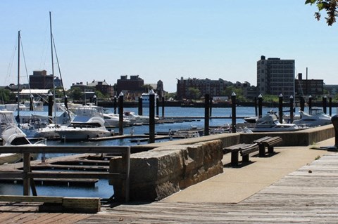 a dock with boats in the water at a marina