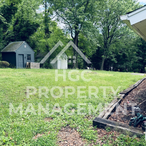 a small house in the middle of a field