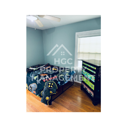 a bedroom with a bunk bed and a window