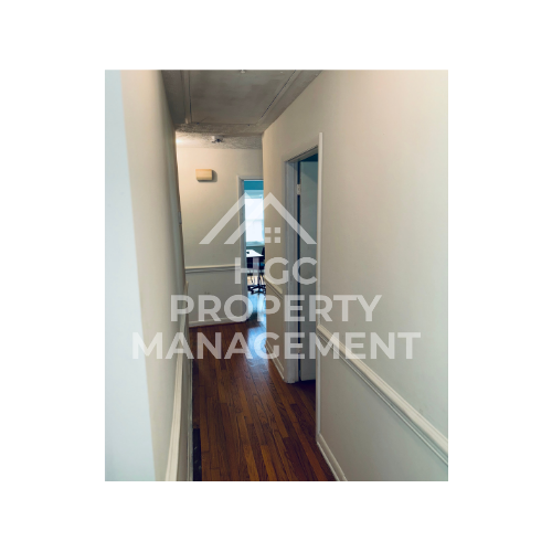 room with a hallway and a door leading into a room