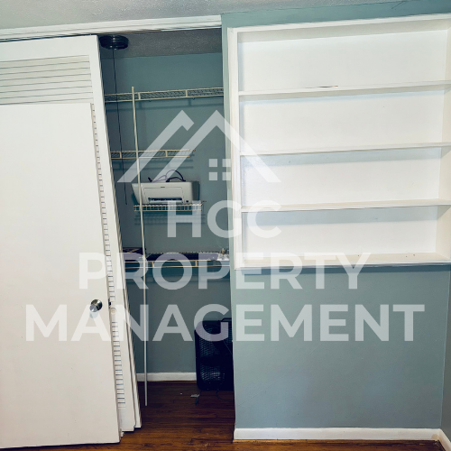 a closet with a mirrored door and a sewing machine in it