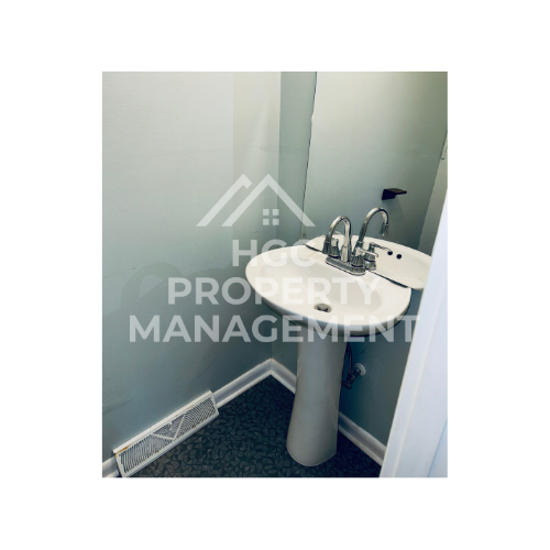 a small bathroom with a sink and a mirror