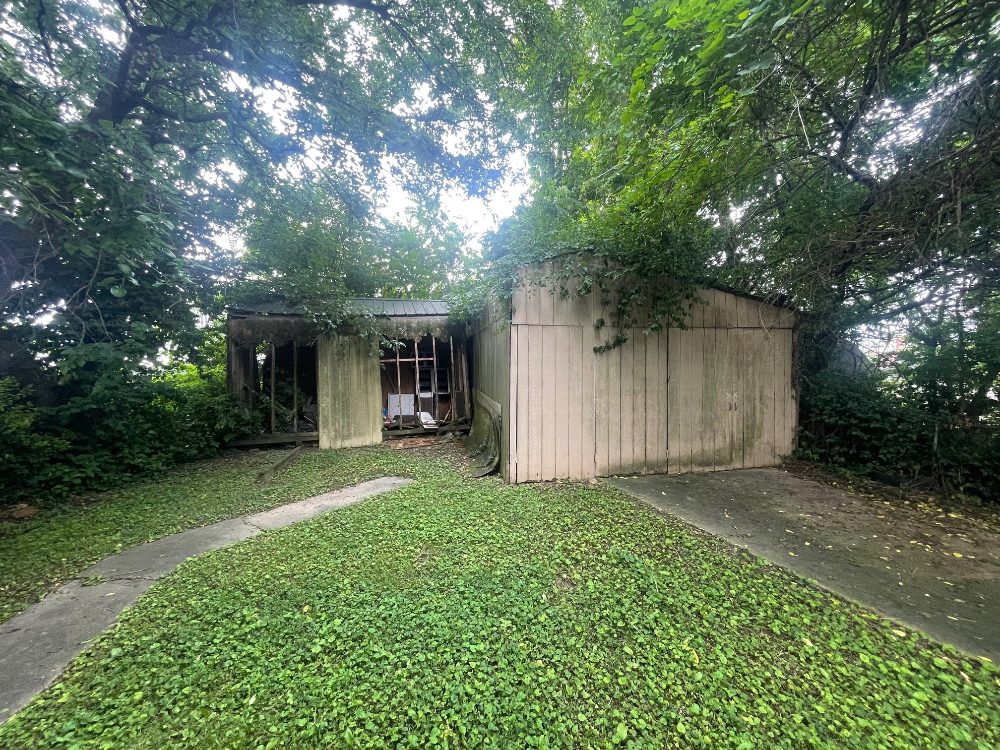 a shed in the backyard of a house