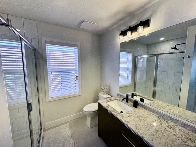 a bathroom with a sink toilet and a shower