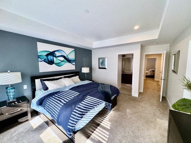 a blue and white bedroom with a bed and a closet