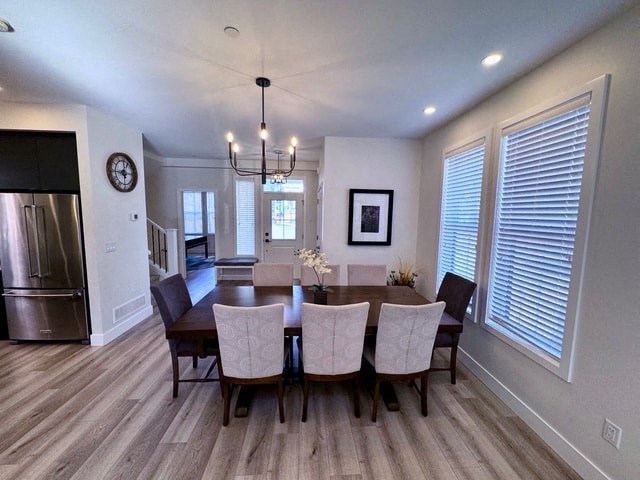 a dining room with a table and chairs