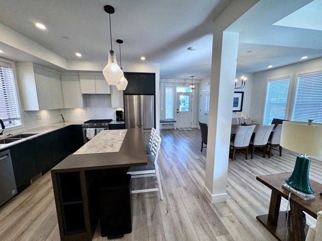 a large kitchen and dining room with a table and chairs