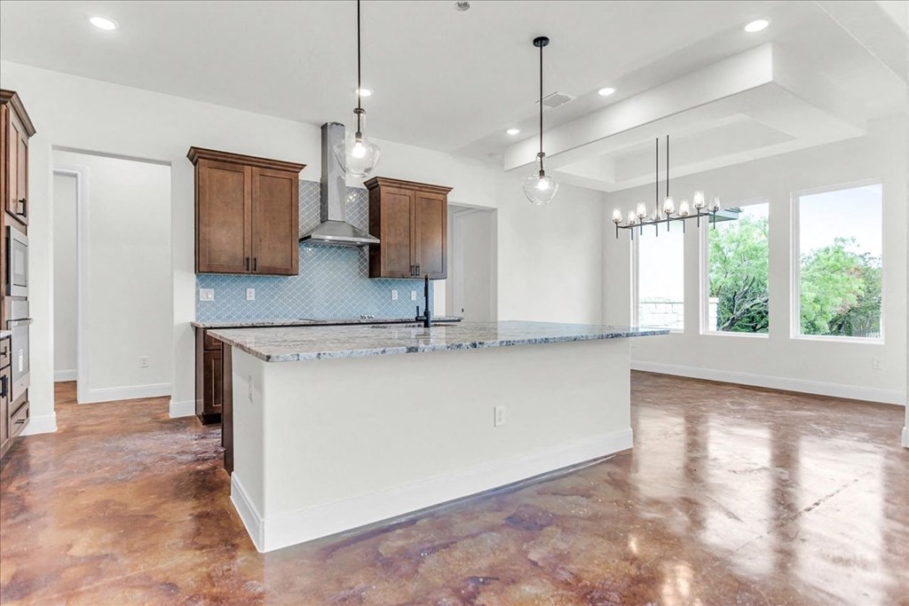 a kitchen with a large island in the middle