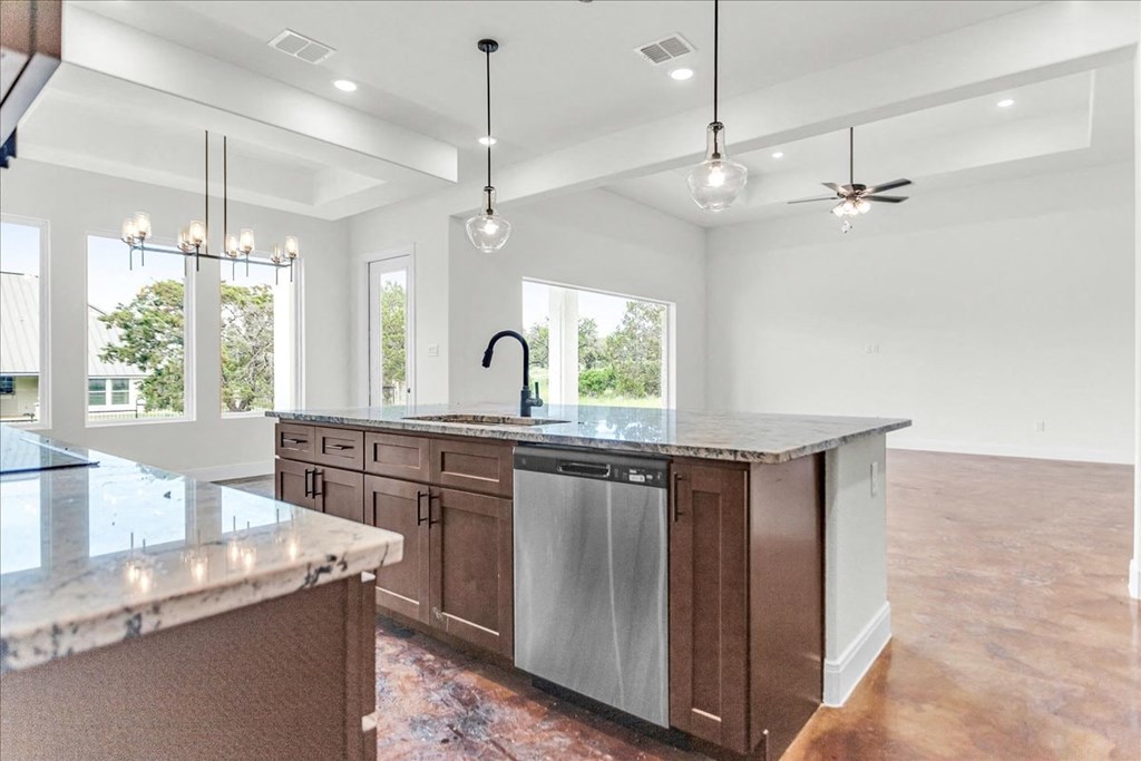 a large kitchen with a large island in the middle