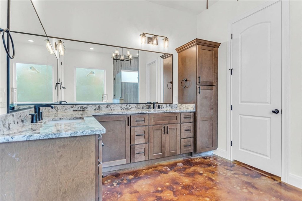 a large bathroom with a sink and a mirror
