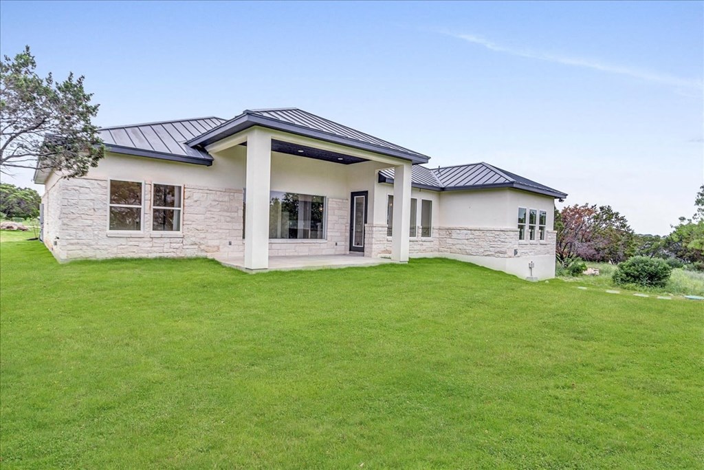 a house with a yard and a green lawn