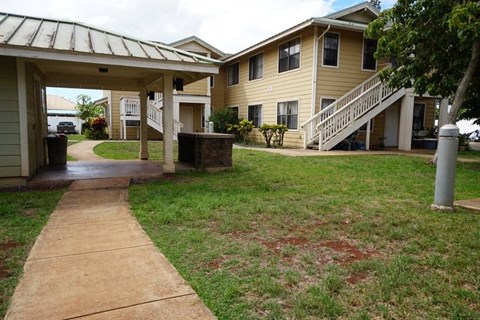 a sidewalk in front of a house
