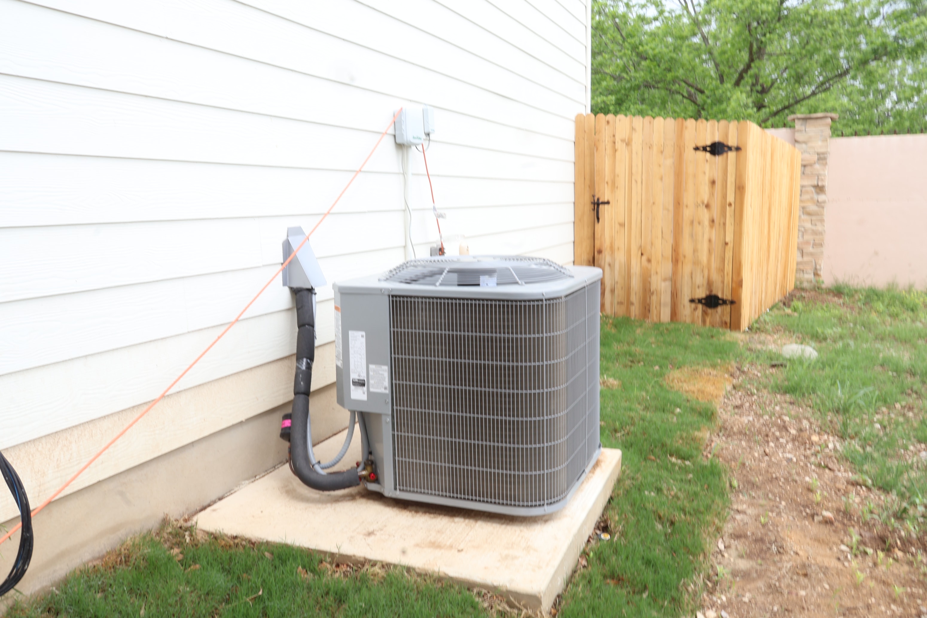 a heat pump on the side of a house