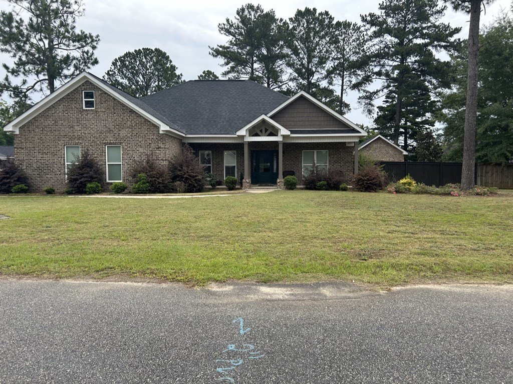 a house with a lawn in front of it