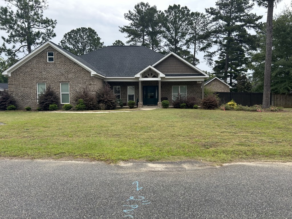 a house with a lawn in front of it