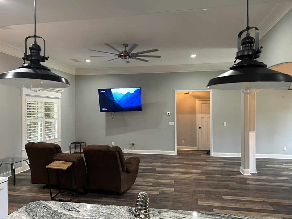 a living room with a tv on the wall
