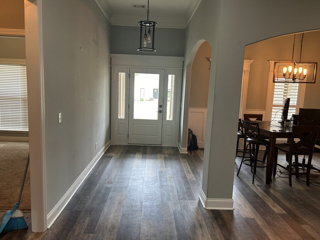 a view of the entryway from the living room into the dining room