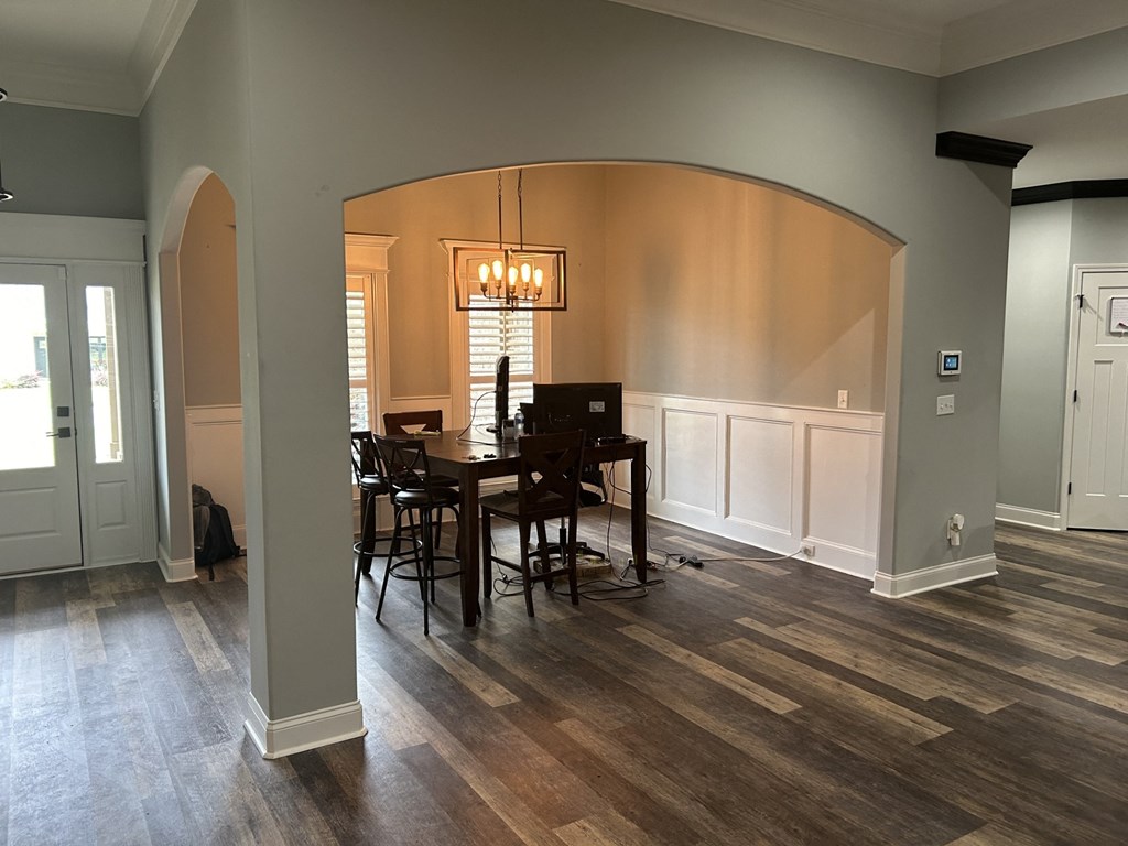 a kitchen and dining room with a table and chairs