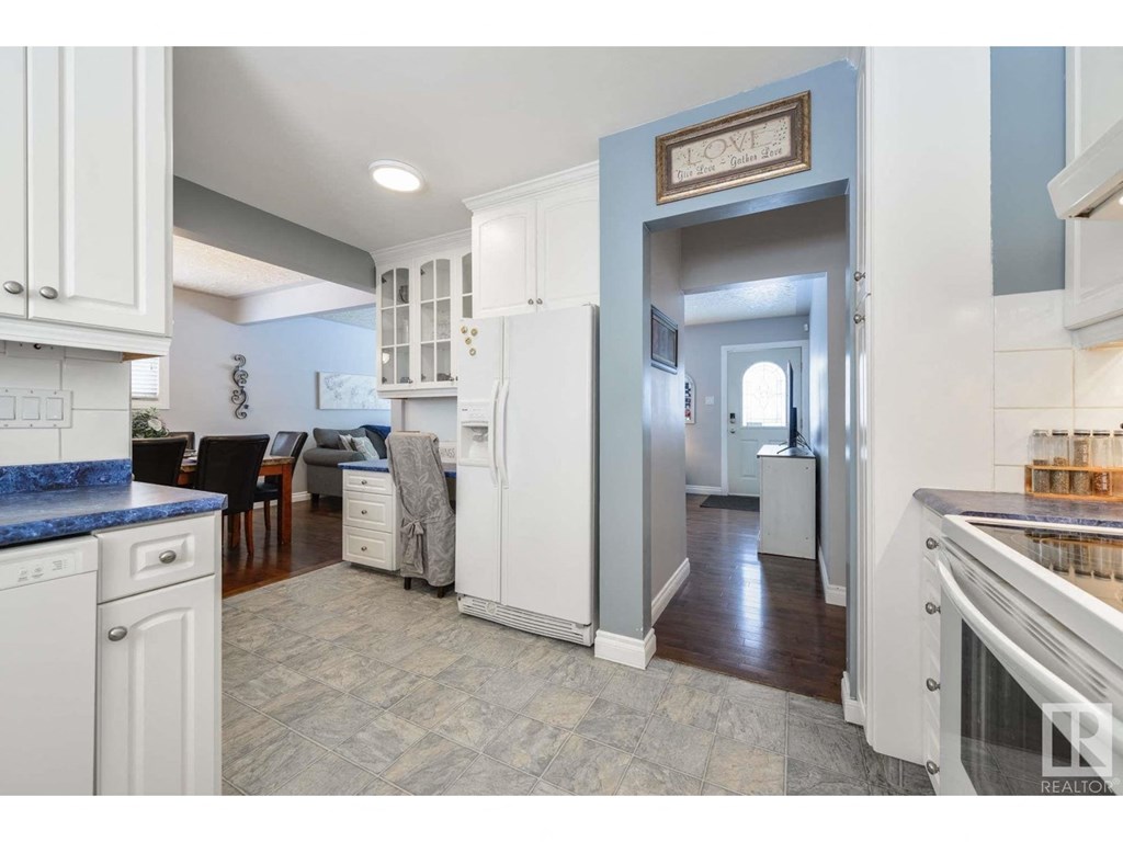 a view of the kitchen and living room from the dining room