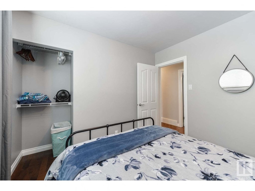 a bedroom with a bed and a closet