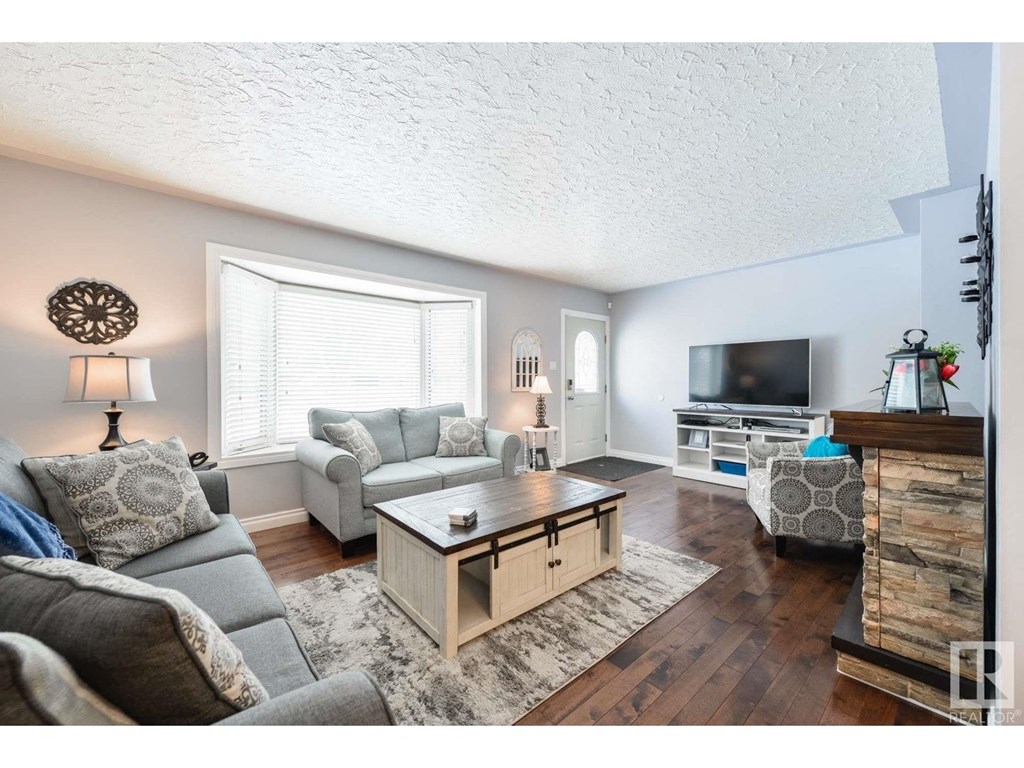 a living room with a couch and a tv