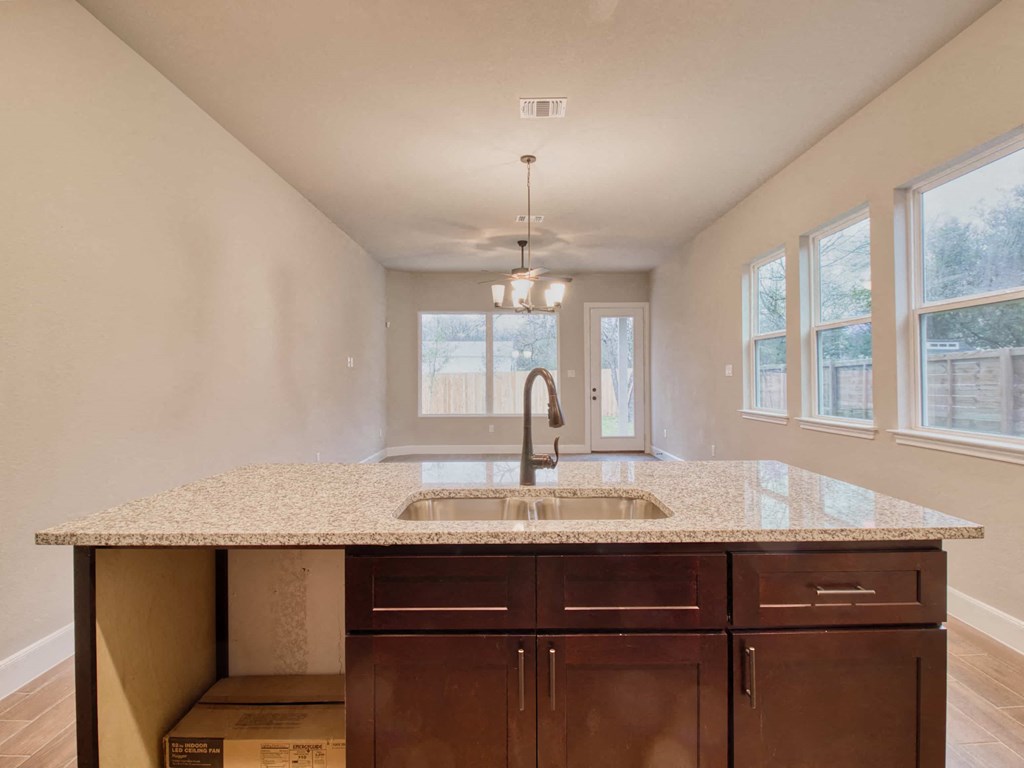 a kitchen with a sink and a counter top