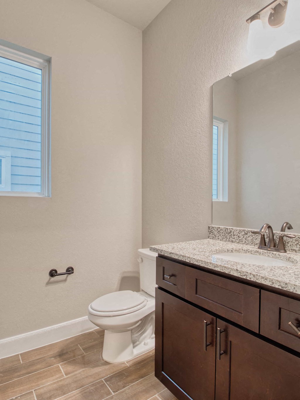 a bathroom with a toilet and a sink