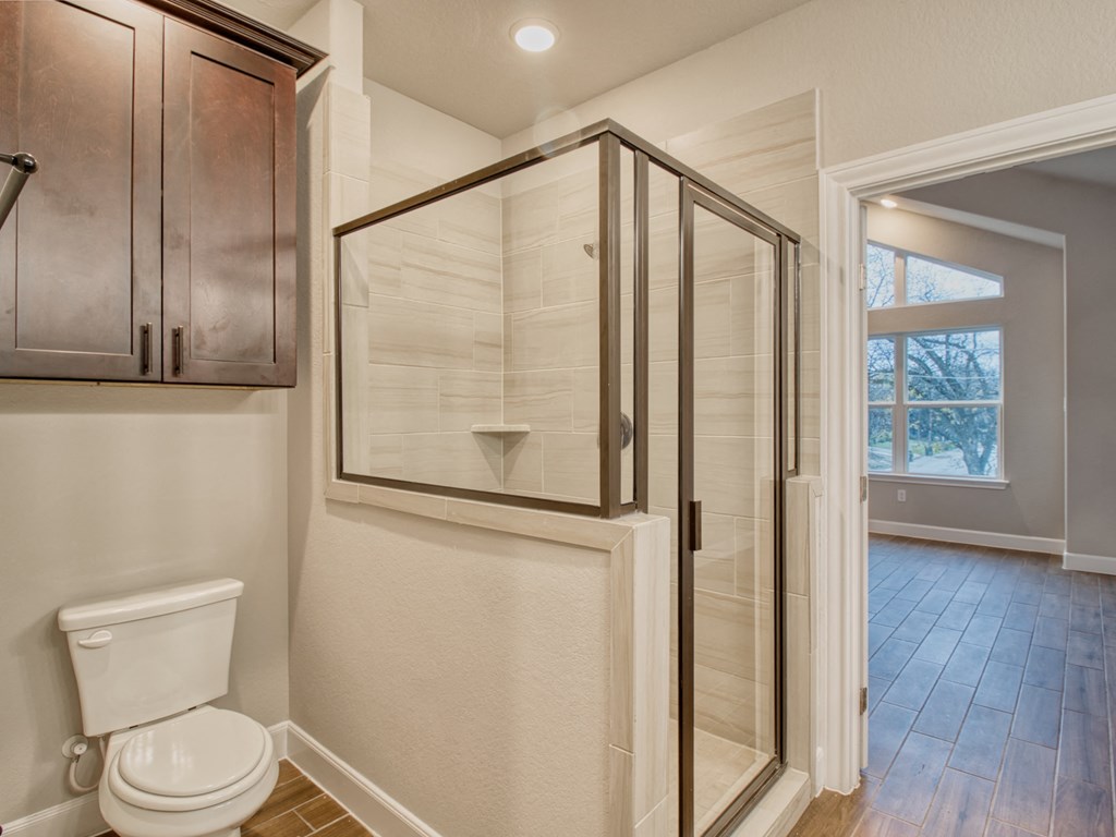 a small bathroom with a shower and a toilet