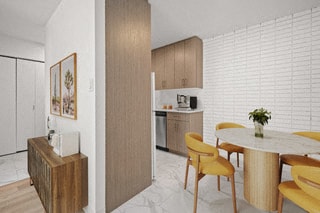 a kitchen and dining room with a table and chairs