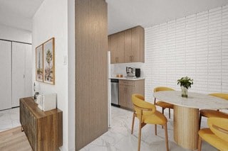 a kitchen and dining room with a table and chairs