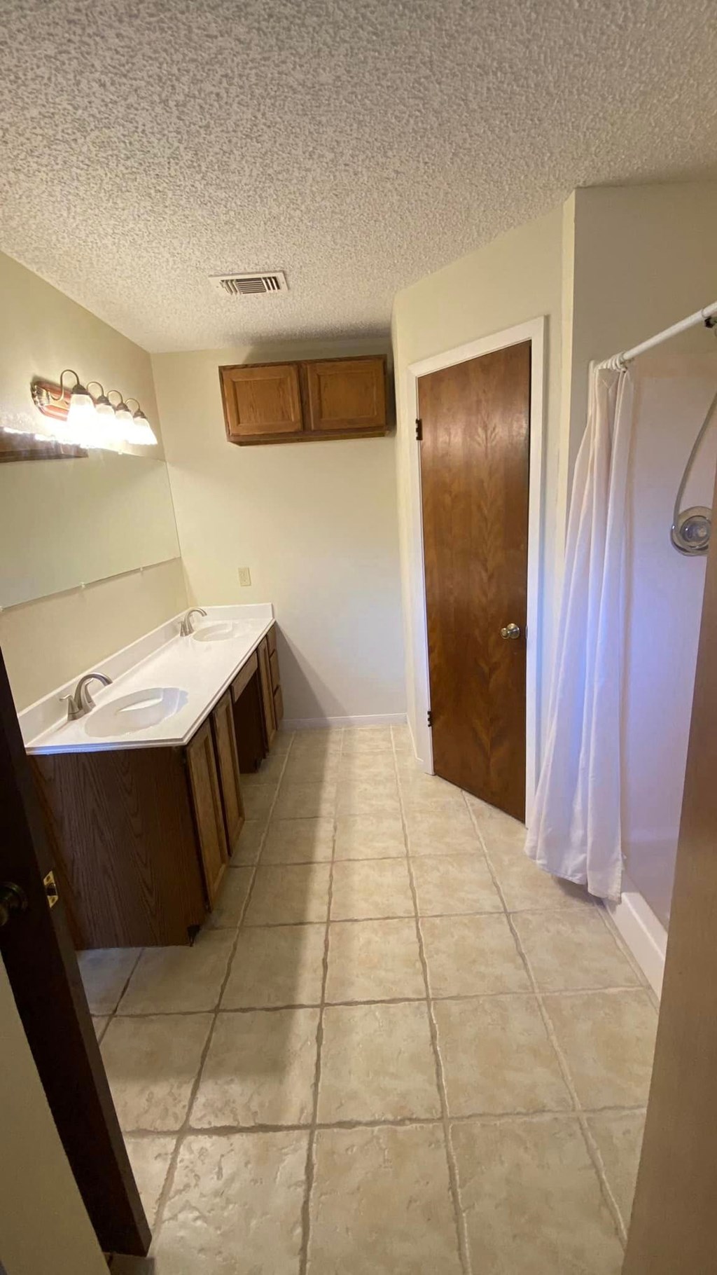 a bathroom with a sink and a shower