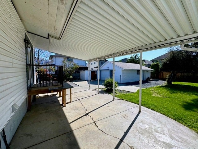 a patio with a white roof on a house