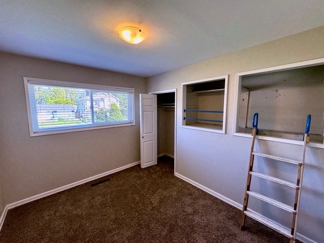 a small room with a ladder and a window