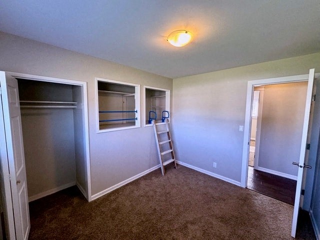 a empty room with a closet and a ladder