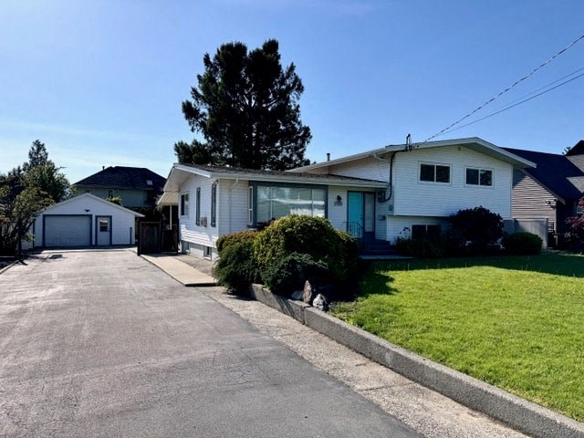 a white house on the side of a street