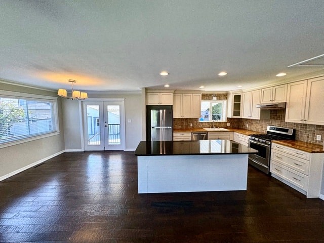 a large kitchen with a large island in the middle