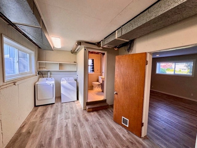 a kitchen with a washer and a dryer in it