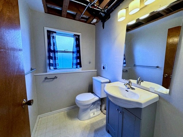 a bathroom with a toilet sink and a window