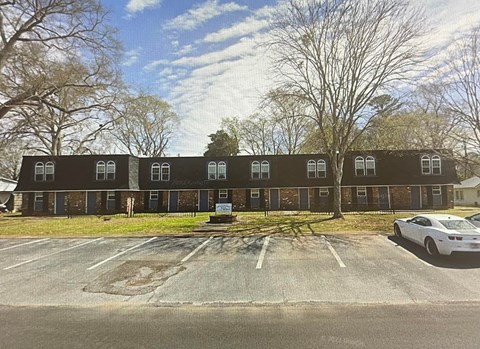 a building with a parking lot in front of it