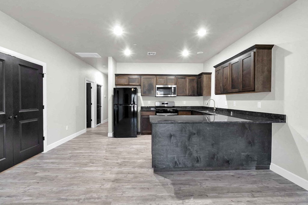 a kitchen with a counter top and a refrigerator