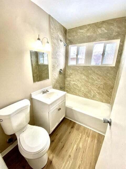 a bathroom with a white toilet and a sink