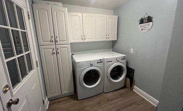 a laundry room with white cabinets and a washing machine