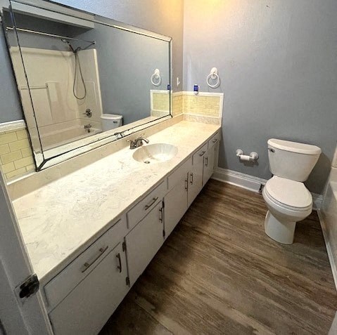 a bathroom with a toilet and a sink and a mirror