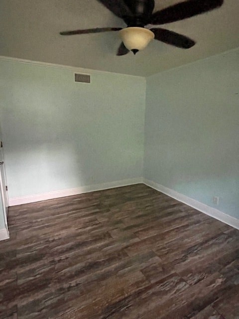 a empty room with a ceiling fan and wood floors