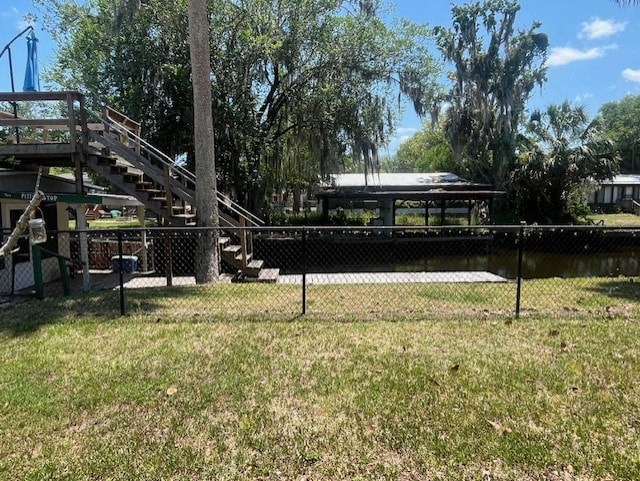 a park with a pond and a playground