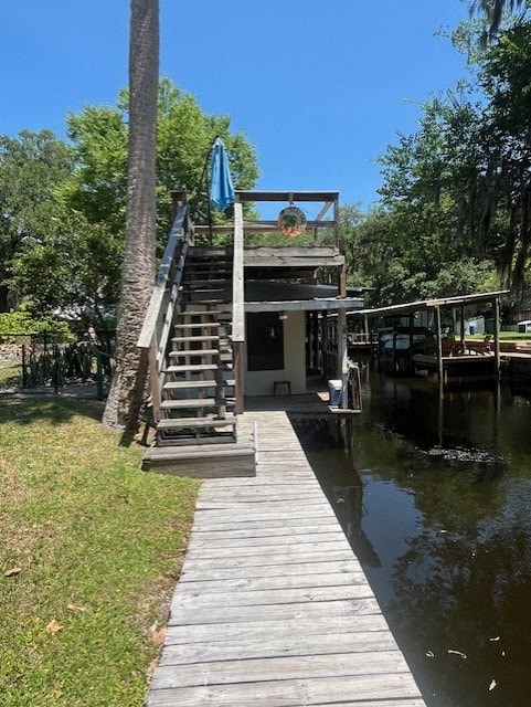 a dock with a house on a body of water