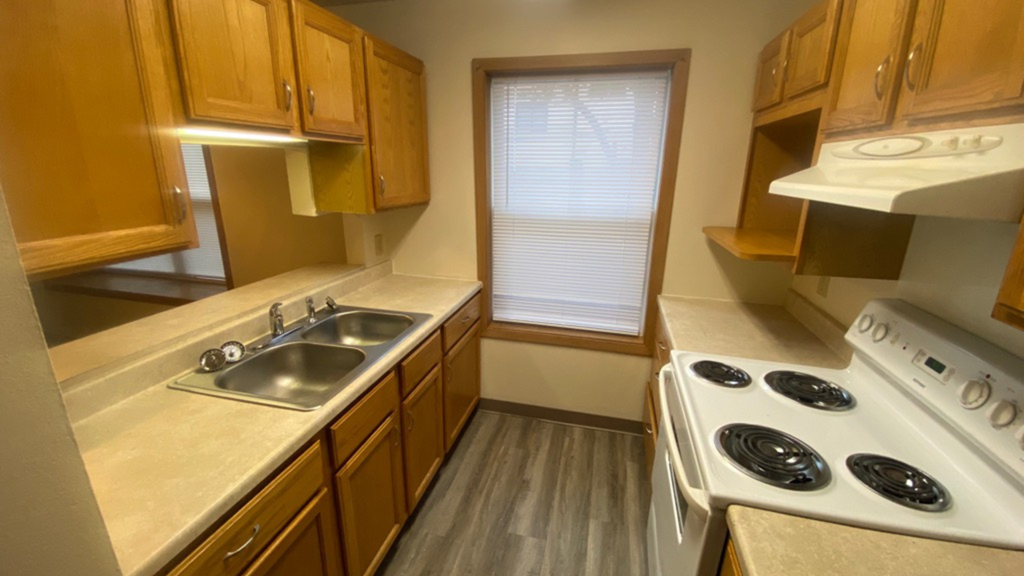 a kitchen with a stove and a sink