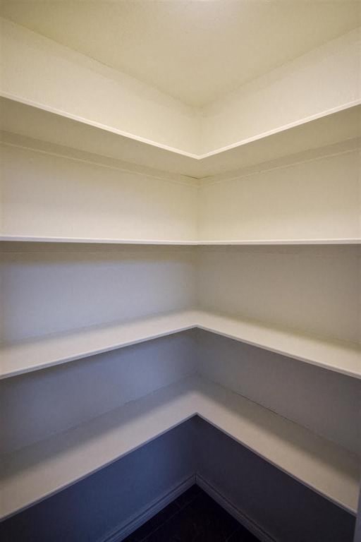an empty room with blue walls and a white ceiling